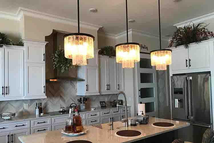 proper lighting elevates the kitchen atmosphere with optimal fixture table distance