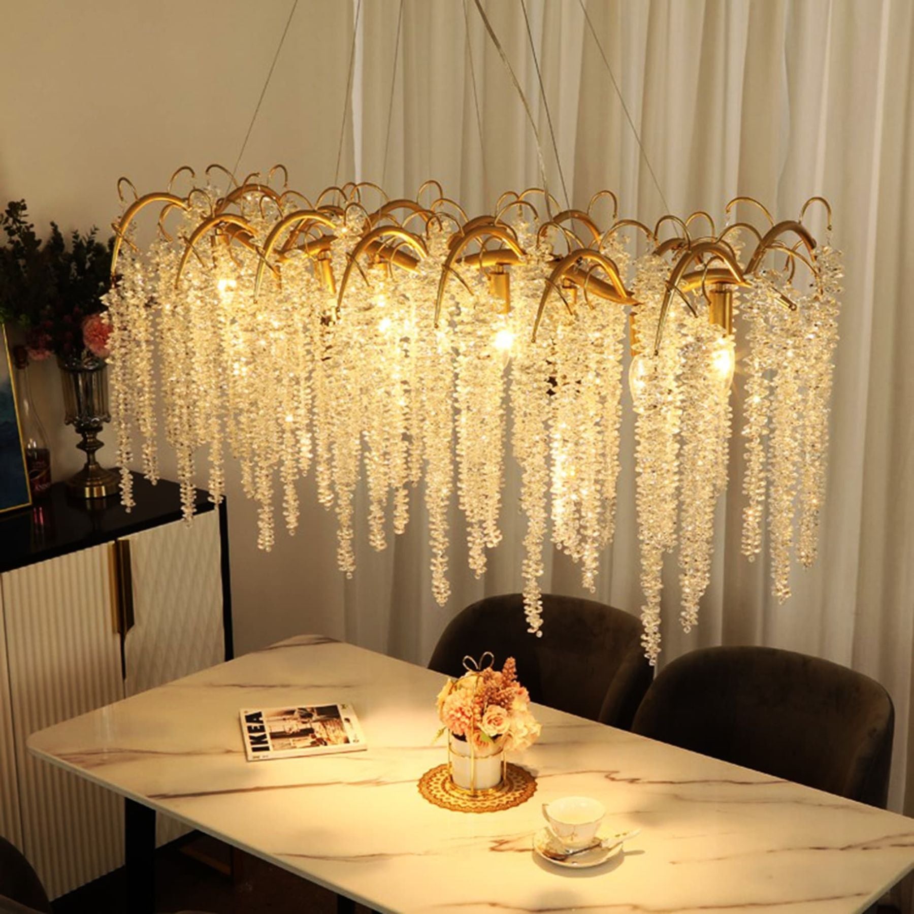the sparkling and captivating orchid crystal pendant creates a warm and soft glow infusing a feeling of cozy comfort into the living room or dining room