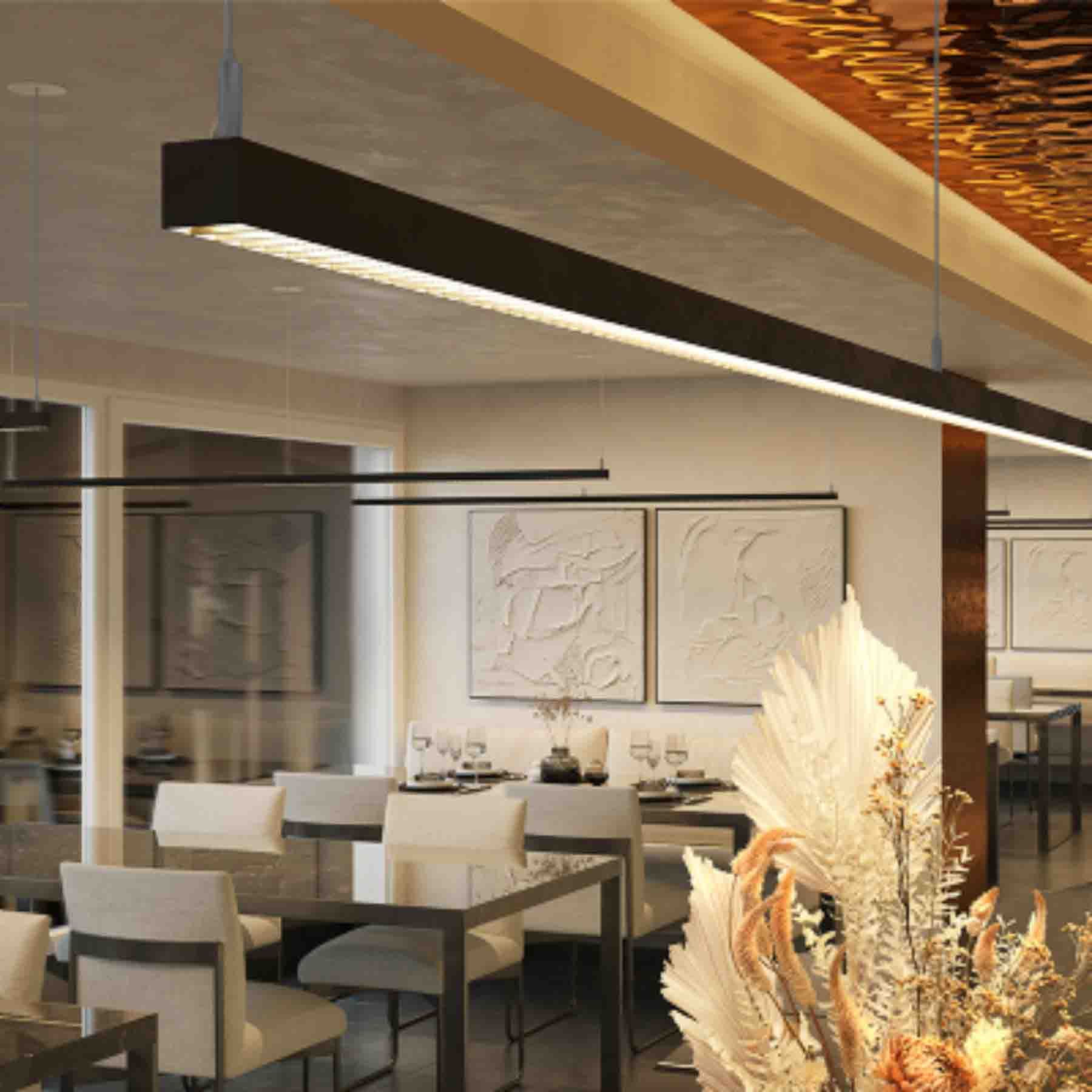 this light serves as the quintessential focal point for a modern minimalist and chic restaurant setting