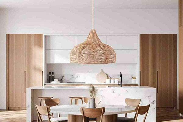 this pendant light efficiently illuminates the entire kitchen area