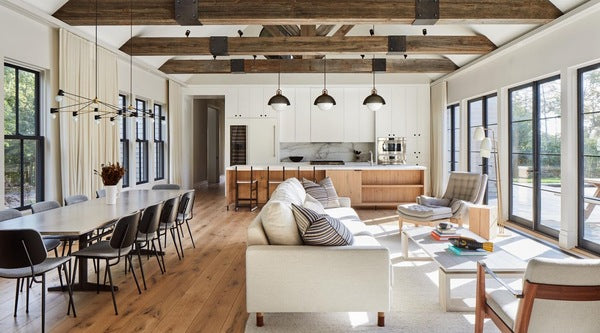 create a unique space by adding exposed wood beams to a farmhouse-style living room