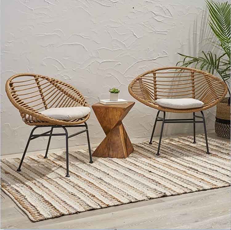 wicker chairs often feature intricate woven patterns often paired with comfortable cushions