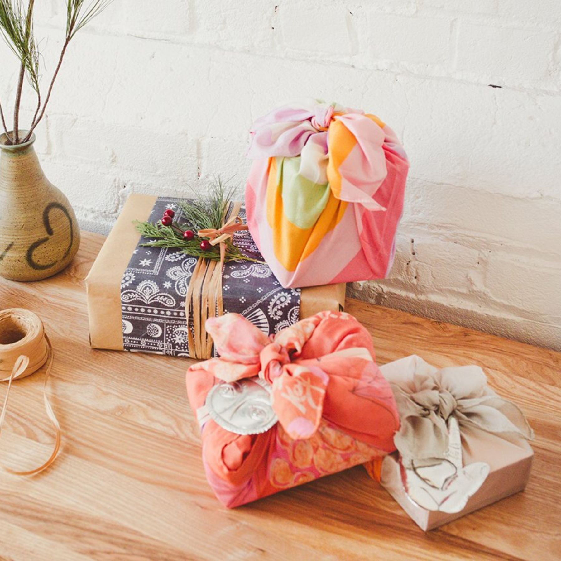 wrap gifts using different fabrics and paper for a unique touch and reusability