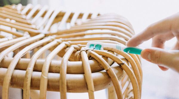 use a dull knife or spoon to remove stains from rattan furniture