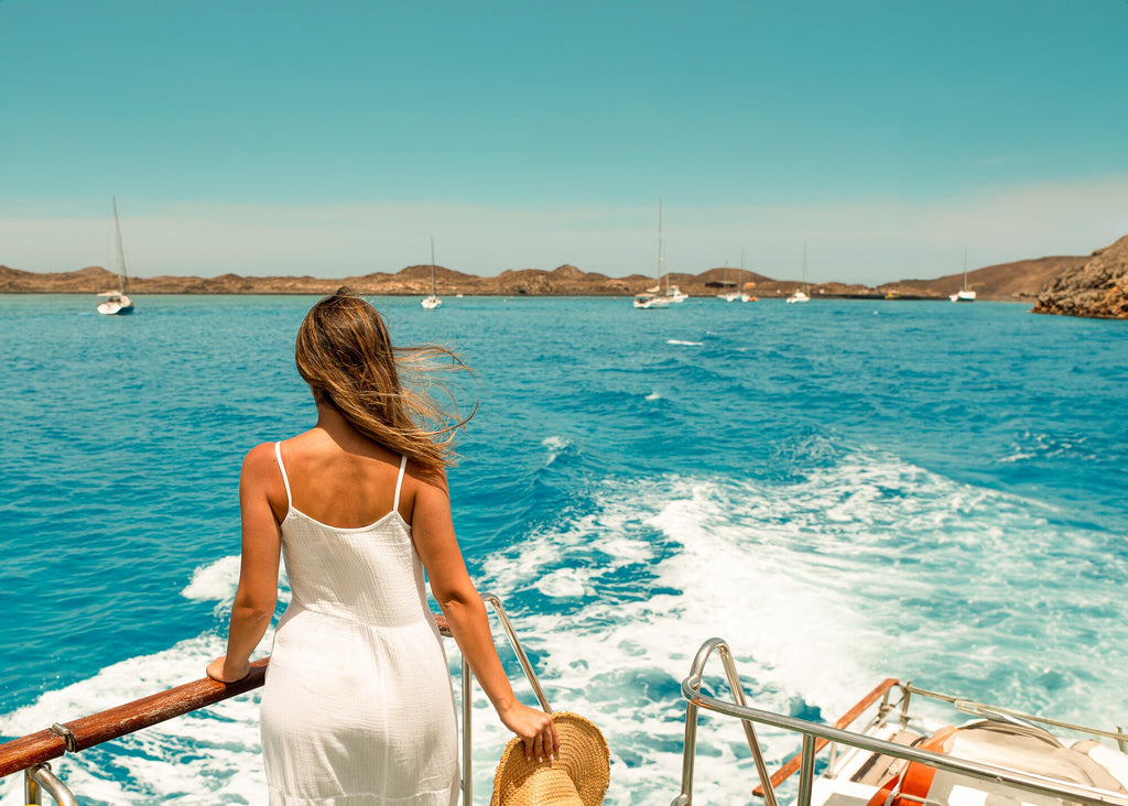 Woman in a White Linen Dress on a Cruise Trip