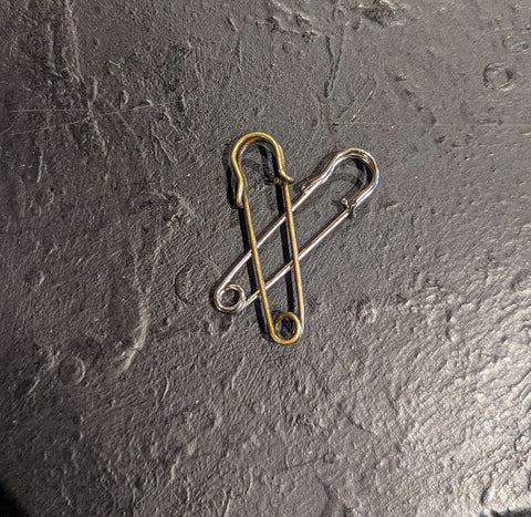 Brass and silver clip pins