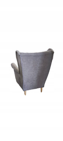 Fotel uszak w stylu skandynawskim jest wolnostojący, na zdjęciu tył produktu fotel uszak w stylu skandynawskim