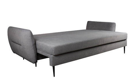 Zdjęcie przedstawiające funkcję spania w nowoczesnej kanapie rozkładanej Ingrid wykonanej w stylu skandynawskim.