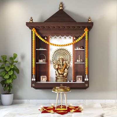 Traditional Pooja room in Lucknow home with intricate wooden mandir.