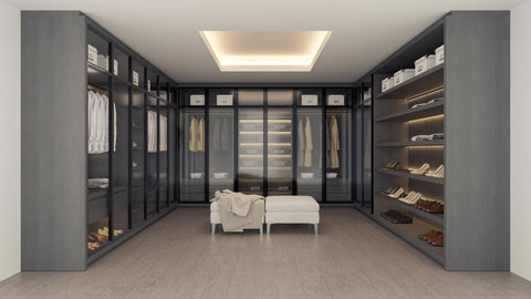 Contemporary walk-in wardrobe in Lucknow with ample shelving and lighting.