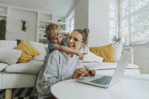 Child and mother playing with the computer