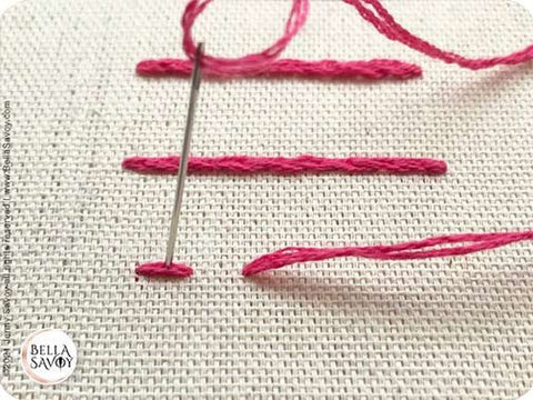 needle going through a seed stitch