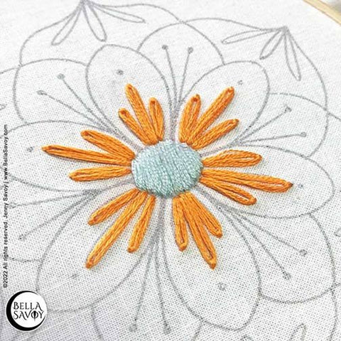 orange lazy daisy stitches around the blue center