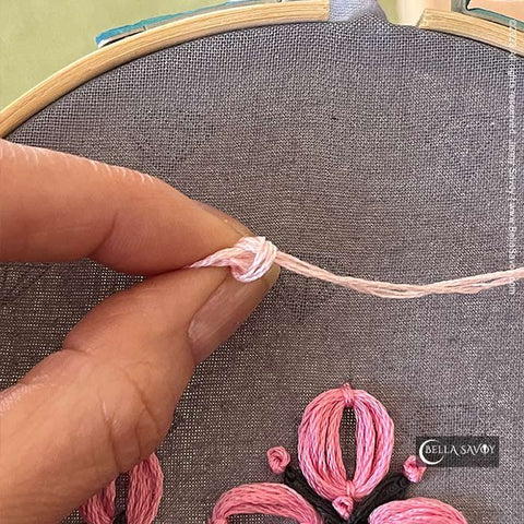 knot on the top of the petal stitch
