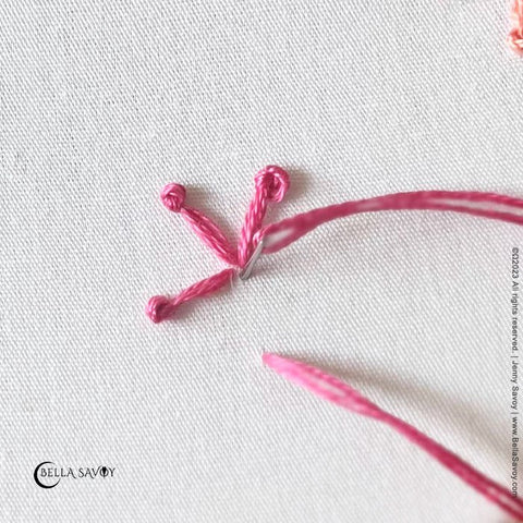 pink thread creating a straight stitch