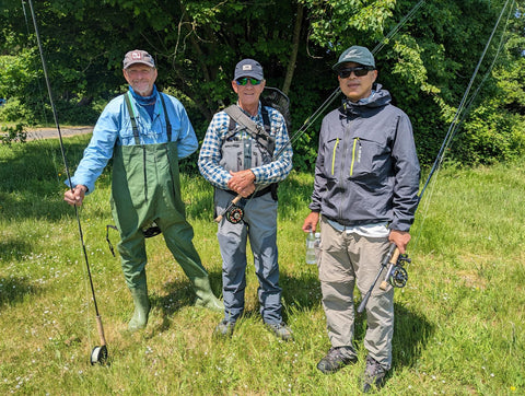 Three anglers dressed in waders