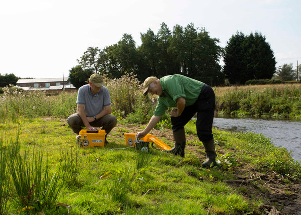 Members of the Mottram St. Andrew Fly Fishing Club carrying out Water Quality Monitoring Network tests on the River Bollin