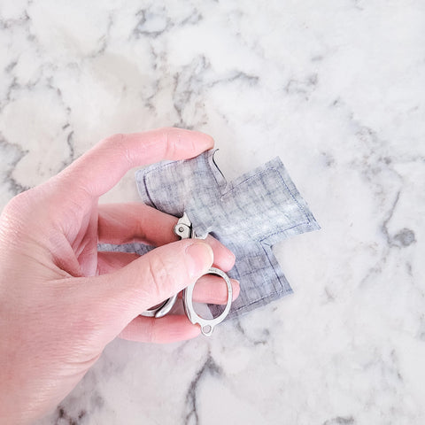 use small scissors to flip out the fabric