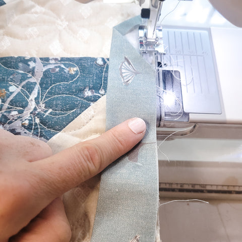 start sewing an inch from bottom of fold
