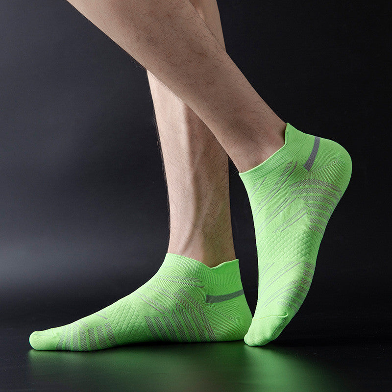 A person wearing lime green patterned athletic socks.