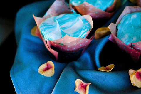 Image of blue velvet cupcakes with swirled meringue.