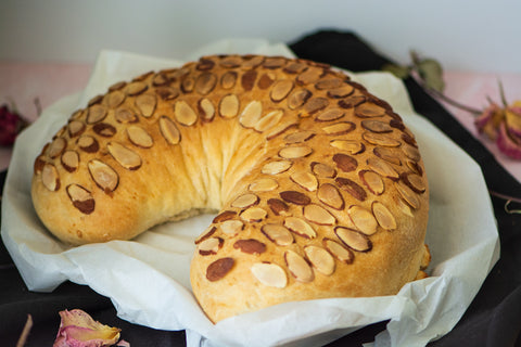 Image of stuffed bread placed on top of parchment paper.