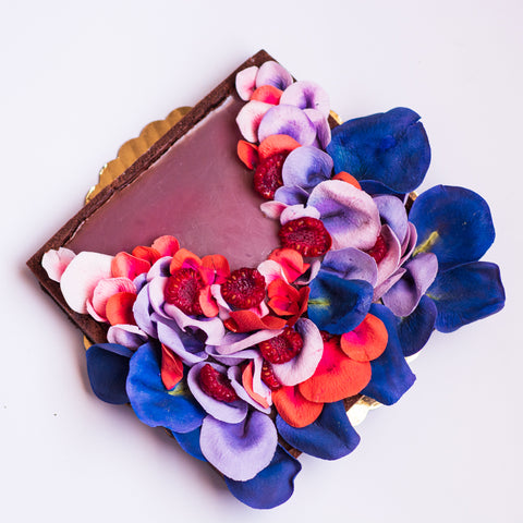 Rectangular-shaped tart decorated with cascade of edible sugar flowers