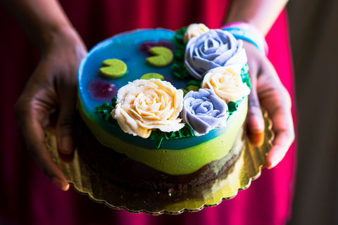 Chocolate-Matcha cake with Matcha mousse, and a jelly "pond." Decorated with lily pad cookies and buttercream flowers.
