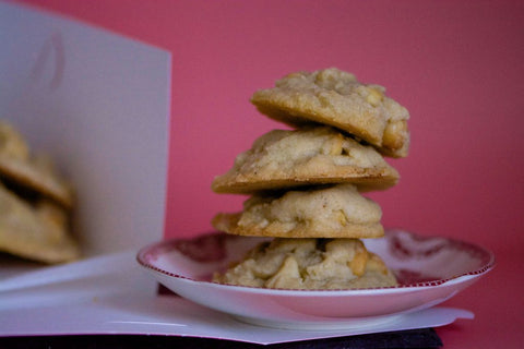 Image of four cookies, stacked on top of a saucer.