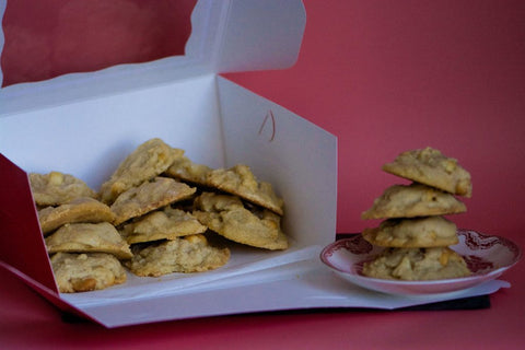 Image of four cookies, stacked on top of a saucer.
