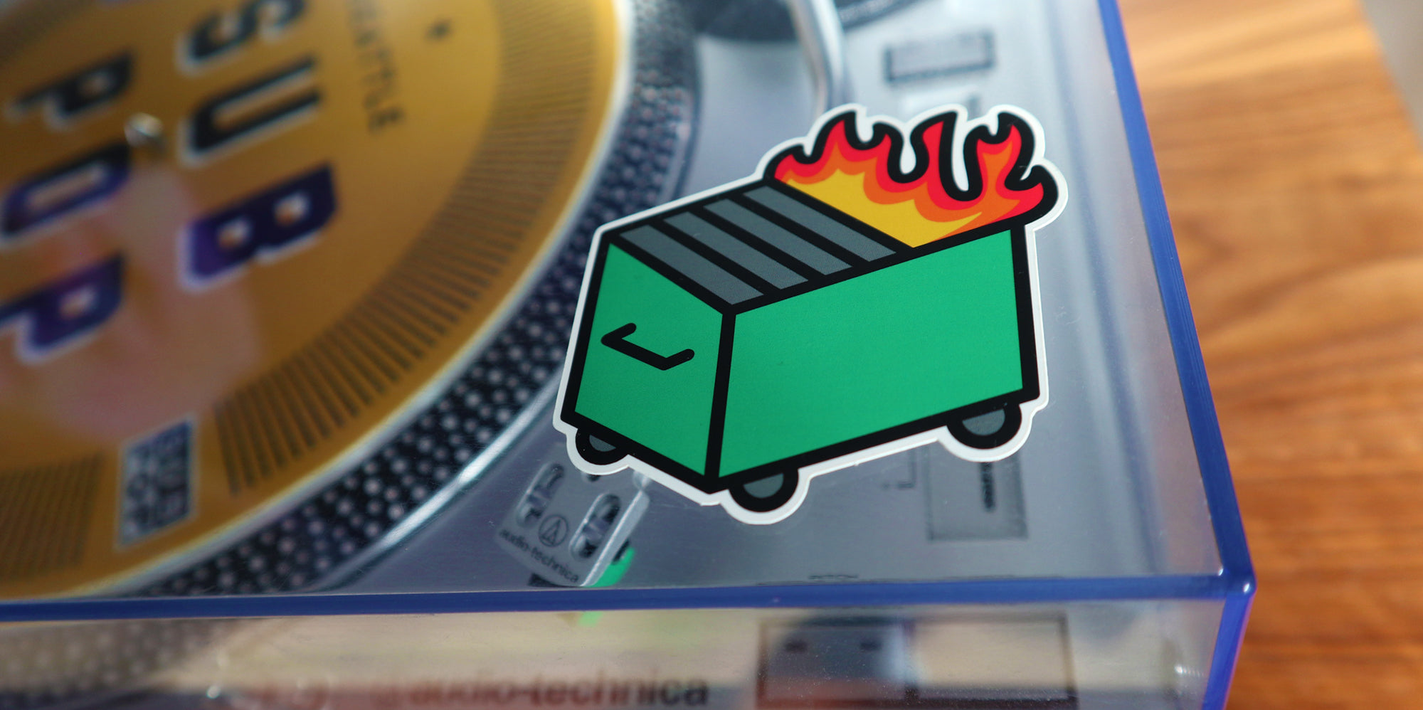 A dumpster fire stuck to the dust cover of a turntable