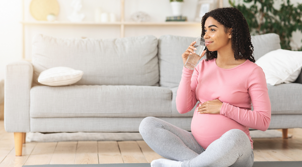 Pregnant woman drinking water