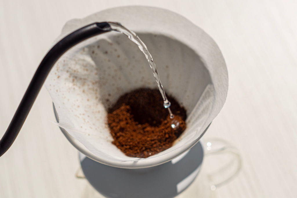Close-Up Shot of a Person Brewing Coffee