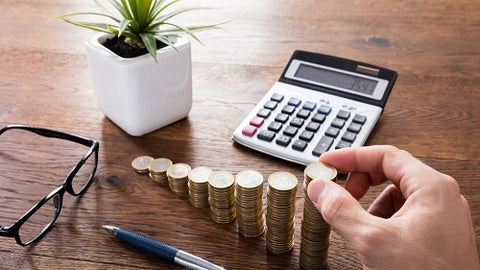 Calculator and coins being counted 