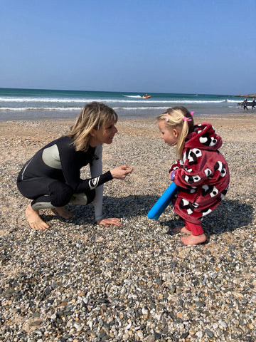 Marketa with child on the beach