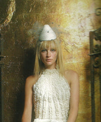 White conical cocktail hat with silver netting