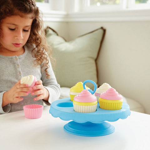 Young child playing with pretend play Cupcake Set