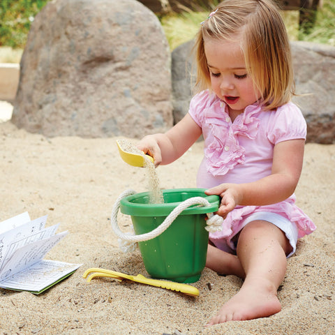 Girl playing with Green Toys Sand Play Set