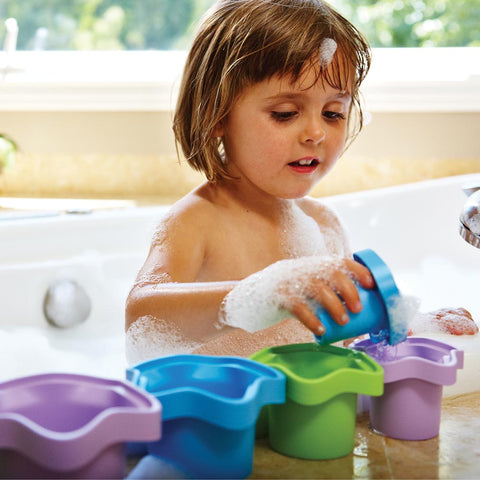 Eco friendly gifts: girl playing with Stacking Cups in the bath