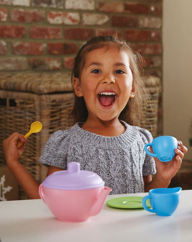 Girl playing with pretend play Toddler Tea Set