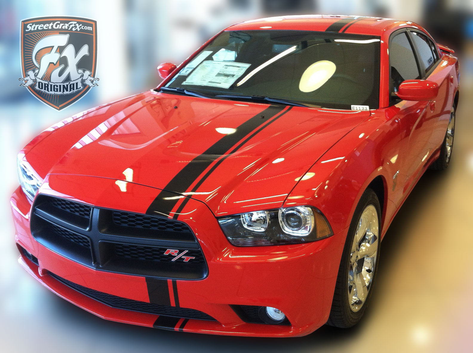 black dodge charger with red stripes