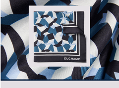 The Duchamp pocket square has been crafted in Italy using the finest silk. Designed with a cubed premium pocket pattern, finished with a luxury Duchamp logo and hand-rolled edges. The perfect addition to our exclusive suits and ties.