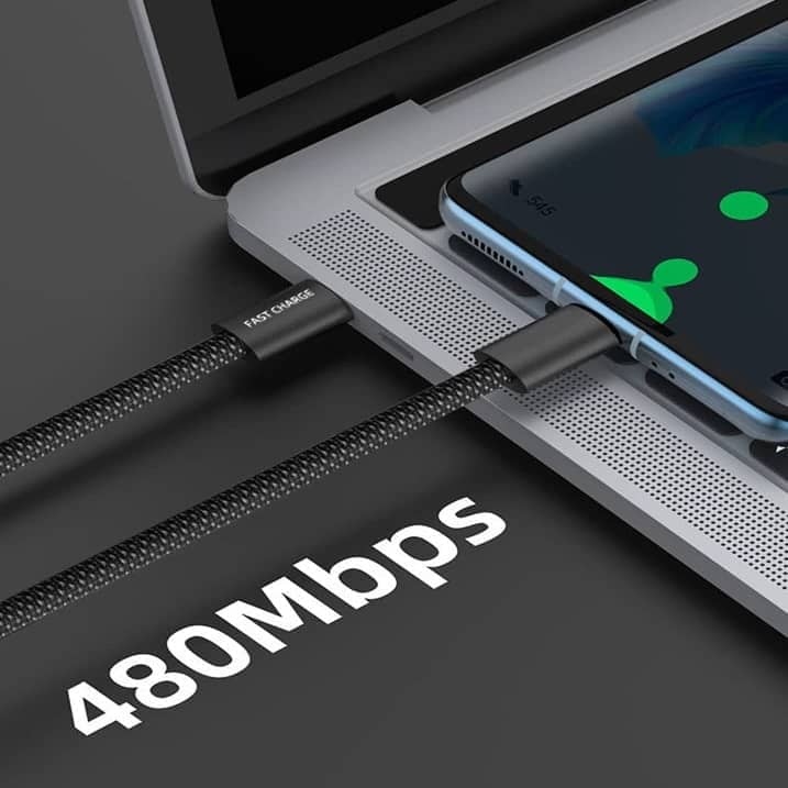A-braided-USB-cable-with-a-Fast-Charge-label-and-PD-100W-marking-connecting-a-laptop-to-a-smartphone-with-the-text-480Mbps-indicating-the-data-transfer-speed-capability