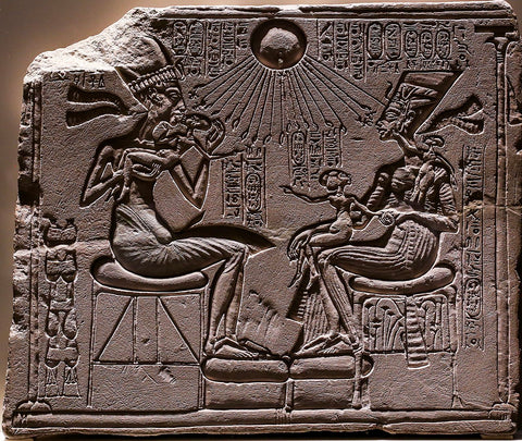 Relief depicting Akhenaten and Nefertiti with three of their daughters under the rays of Aten.