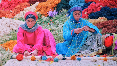 Tribal Women weaving a rug - What makes Persian rugs valuable