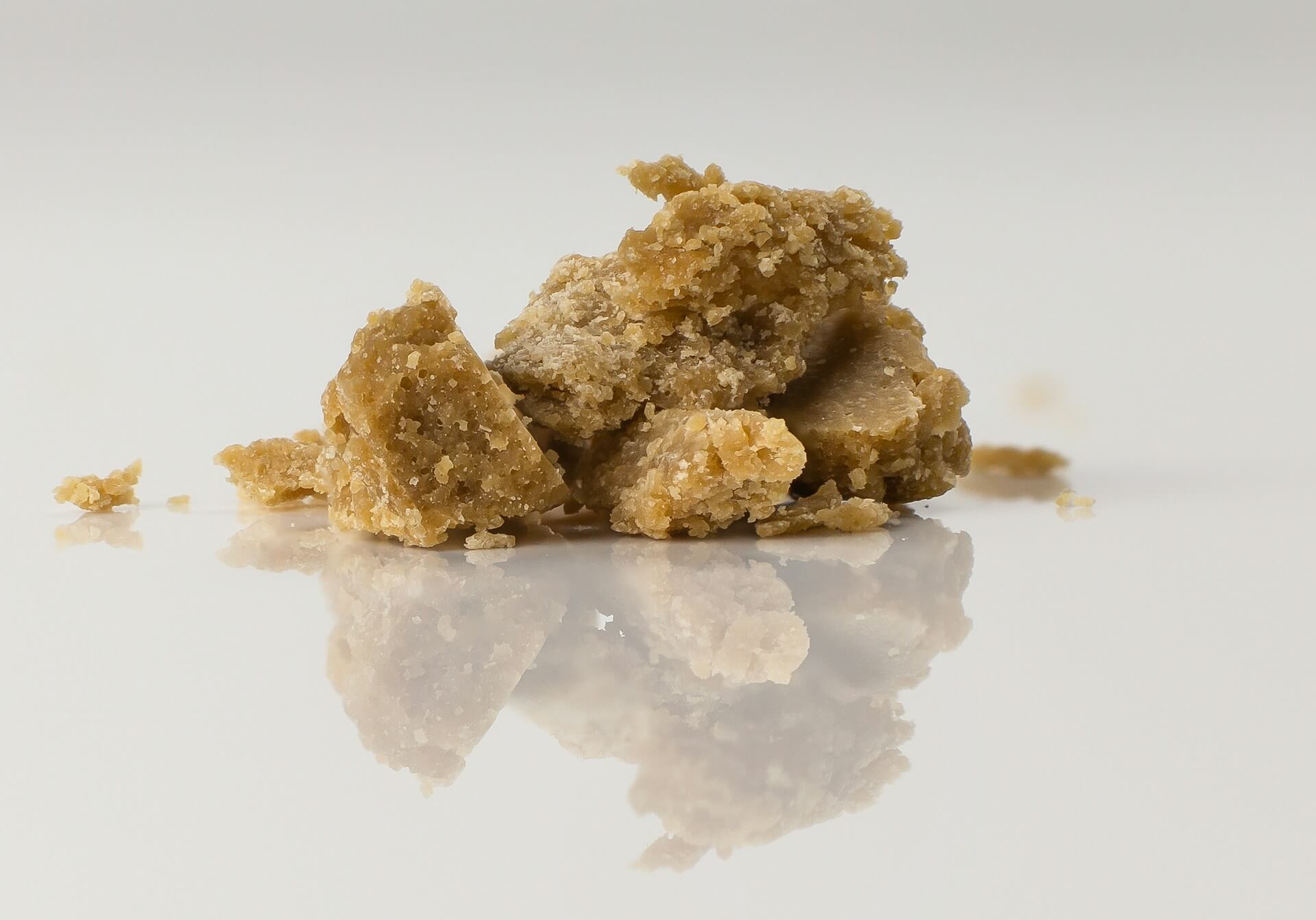 Close-up photo of cannabis extract on white plate