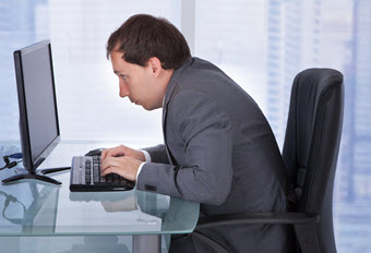 Man sitting with poor posture