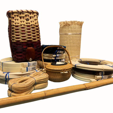 Flat Reed, Strand Cane, Reeds, Rattan Poles, Cane Webbing, a Nantucket Basket, and a Finished Wine Basket on the table with white background.