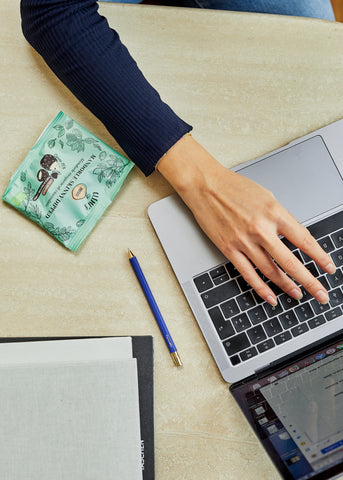 Skinny Dipped Almonds and Hand Typing on Computer