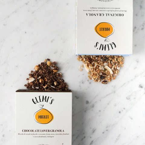 Box of original granola and chocolate lover granola by Clemi's Market on marble background